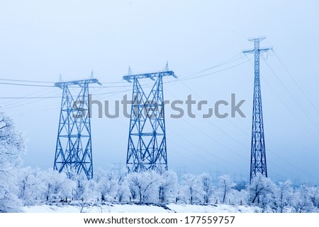Electrical high-voltage metal pillars in winter