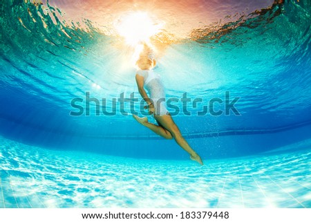 underwater swimming and reflection in water