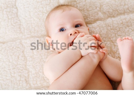 puzzled child with his foot in the mouth