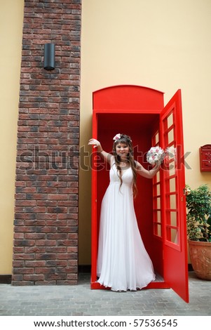 bride in the red telephone cabin