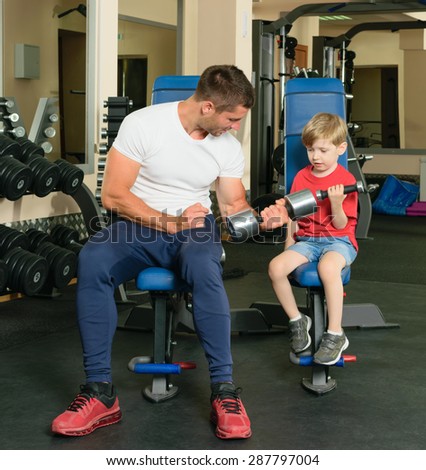 Pope shows little son how to lift weights in the gym
