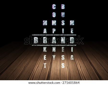 Advertising concept: Glowing word Brand in solving Crossword Puzzle in grunge dark room with Wooden Floor, black background, 3d render