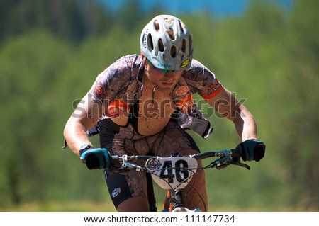 ASPEN, CO - AUG 25: Evan Pletcher uphill at The Power of Four mountain bike race in Aspen, CO on Aug 25, 2012