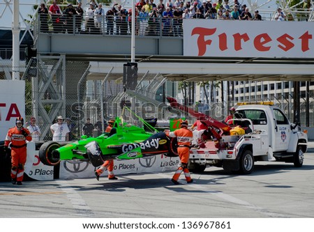 LONG BEACH, CA - APRIL 21:James Hinchcliffe\'s car gets lifted away at the  Izod Indycar Grand Prix in Long Beach, CA on April 21, 2013