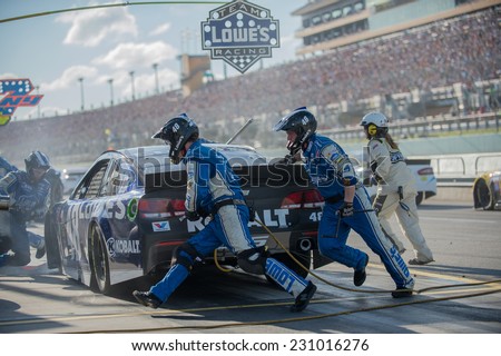 MIAMI, FL - Nov 16: Jimmie Johnson  pit stop at the Nascar Sprint Cup Ford Ecoboost 400 race at Homestead-Miami Raceway in Homestead, FL on November 16, 2014