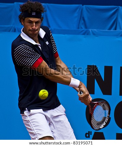 NICE, FRANCE - MAY 15: Dutch tennis player Robin Haase hits a backhand ball in a tennis match during the 2011 ATP Nice Cote d\'Azur Open tennis tournament on May 15, 2011 in Nice, France