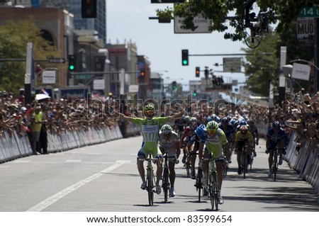 Denver, CO - AUG 28: Team Liquigas is leading the peloton around the streets at the 2011 USA Pro Cycling Challenge in Denver, Colorado on Aug 28, 2011