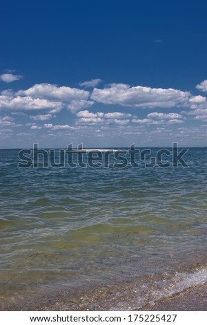 The cobalt blue sea and blue sky. Summer landscape with sea and blue sky