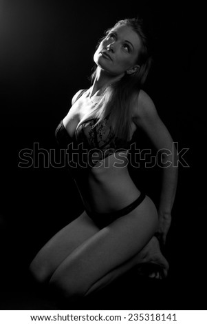 Sexy woman body in lingerie on black. Black and white sensual beautiful girl.