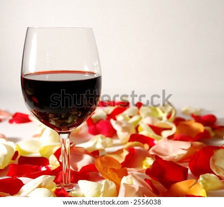 wine glasses on flower petals for valentines day
