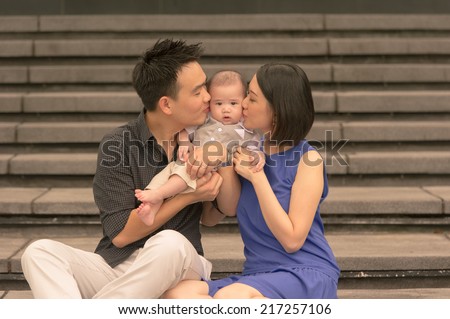 Young Asian Chinese family with 5 month old son