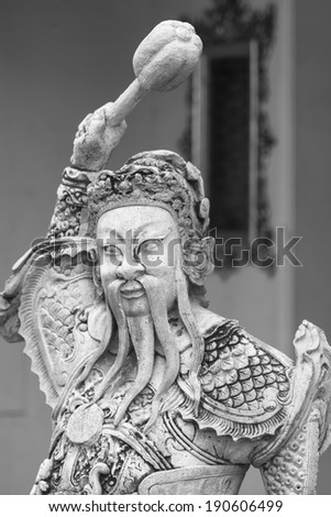 black & white of Chinese stone sculpture doll in Wat Pho temple,