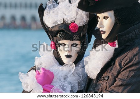 VENICE,ITALY-FEB.12 : Unrecognizable couple wearing carnival costume and posing in Saint George island February 12, 2010 in Venice, Italy. In 2010 the Carnival was held between 11-16 February.