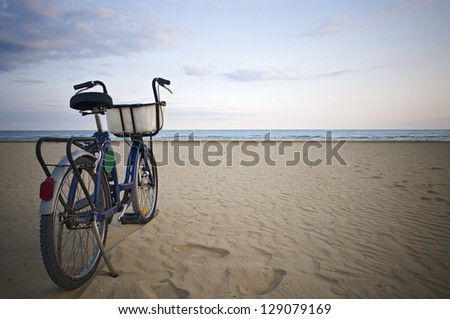 Parked bicycle along an empty beach
