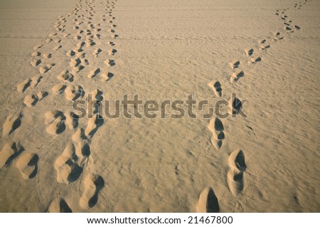 Human footprints on sand surface