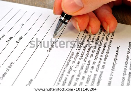 hand signs the document