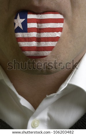man with open mouth spreading tongue colored in liberia flag as symbol of values like teaching, learning, multilingual speaking of different languages