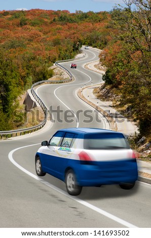 traveling car in national flag of nicaragua colors and beautiful road landscape for tourism and touristic adertising