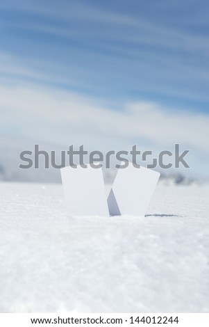 Two blank winter sport ski pass tickets with scenic background. Concept to illustrate winter sport admission fee