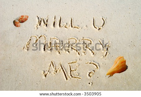 Will You Marry Me Proposal Written in Beach Sand
