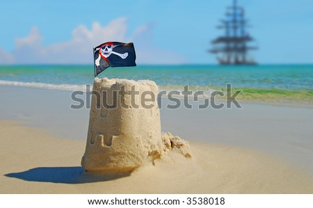 Pirate Sand Castle with Pirate Ship in Distance