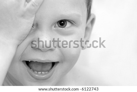 Young Toddler Boy Playing Peek A Boo