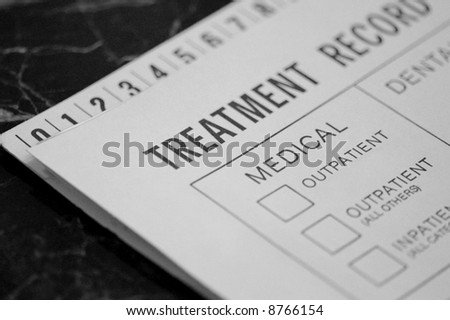 Medical Treatment Record on Exam Table