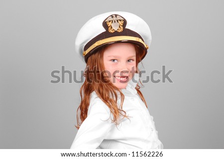 Young girl wearing officer sailor\'s cap