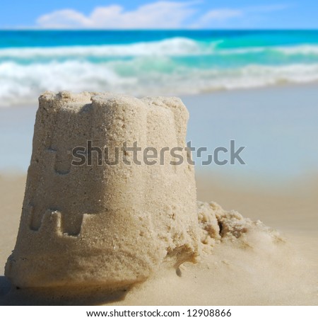 Pretty sand castle with ocean in distance