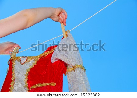 Elegant gown being hung out to dry on clothes line