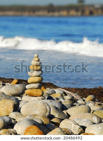 Stacked rocks on pretty seashore