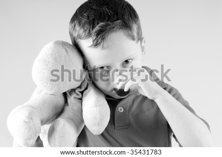 Young boy taking medicine while sick