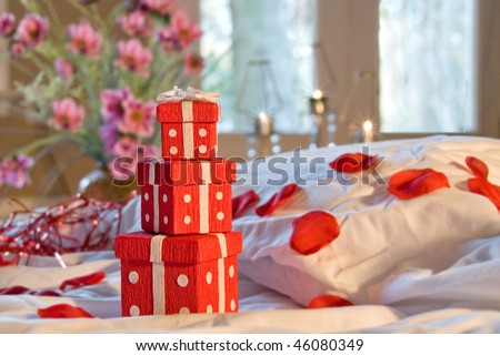 Pretty presents on romantic bed