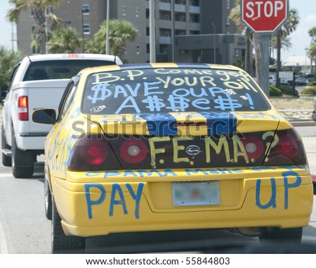 PENSACOLA BEACH - 23 JUNE: A local resident advertises their anger about the BP oil spill with writing on a car on June 23, 2010 in Pensacola Beach, FL.