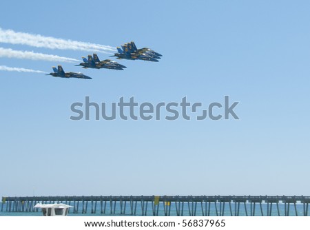 PENSACOLA BEACH - 8 JULY: The U.S. Navy Blue Angels flight demonstration team perform over Pensacola Beach, Florida on July 8, 2010 as part of the annual \