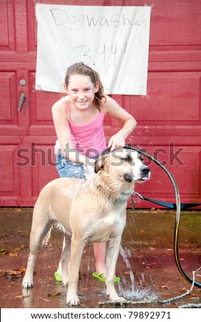 Cute girl washing dog to earn money
