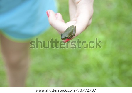 Tomboy showing off tiny tree frog