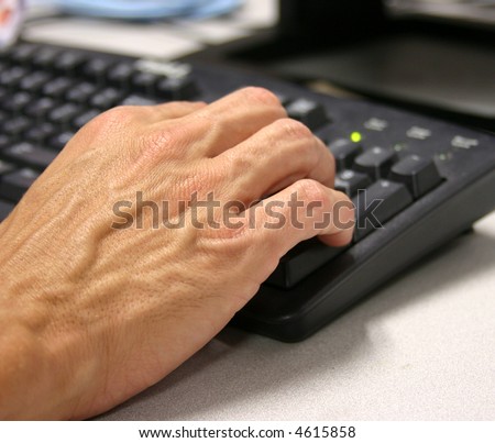 Closeup of hand on keyboard