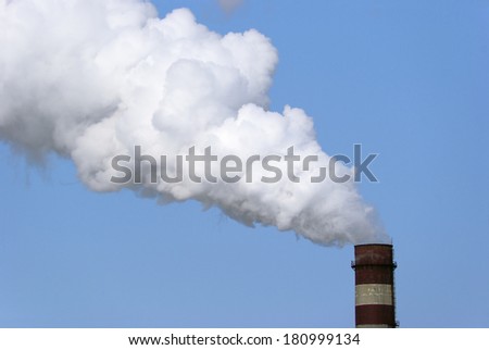 Factory pipe and white cloud of pollution