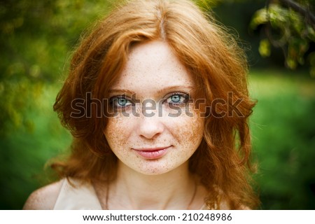 https://image.shutterstock.com/display_pic_with_logo/812176/210248986/stock-photo-portrait-of-redhead-girl-with-blue-eyes-on-nature-face-of-young-woman-with-freckles-closeup-210248986.jpg