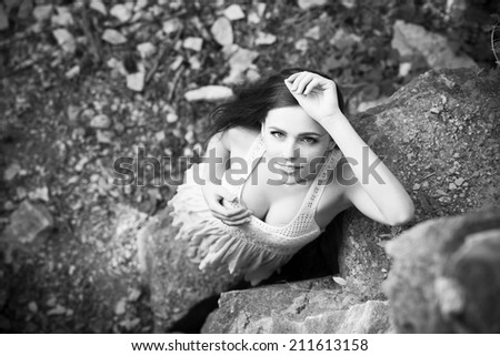 Portrait of a beautiful young woman on nature. Black and white photography