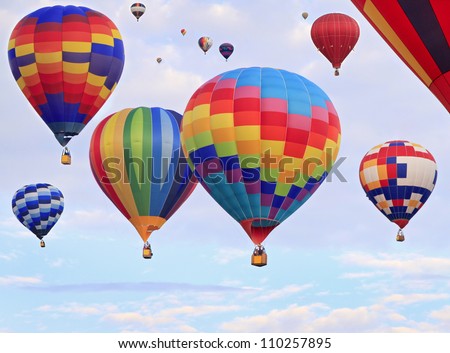 Multicolored hot air balloons flying