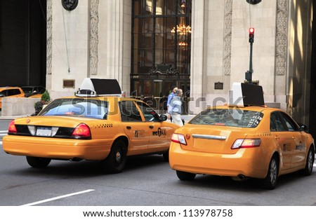 NEW YORK - AUG 24: Busy yellow taxis in traffic. The taxicabs, with their distinctive yellow paint, are a widely recognized icon of the city on August 24, 2012 in New York, USA.
