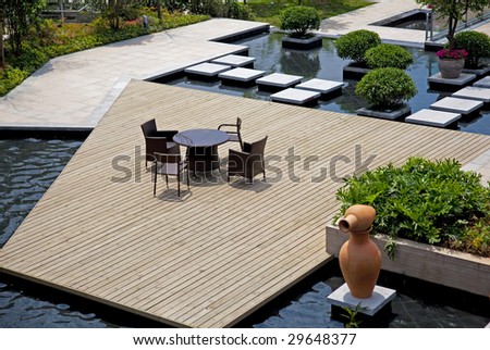 Small square  with chairs and table view from the top in residential district