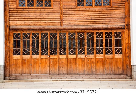 Chinese old wooden door and wall in a ancient building,this style is used in several hundred years ago