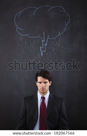Businessman with a storm cloud above his head draw in the backboard