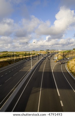 a highway with a cloudscape scenic