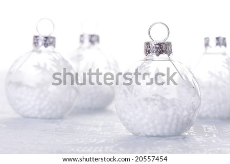 christmas cold background, with snow and christmas balls (selective focus)