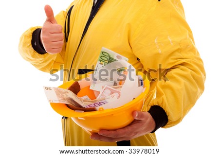 worker showing his helmet full of money