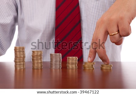 businessman finger walking over money piles
